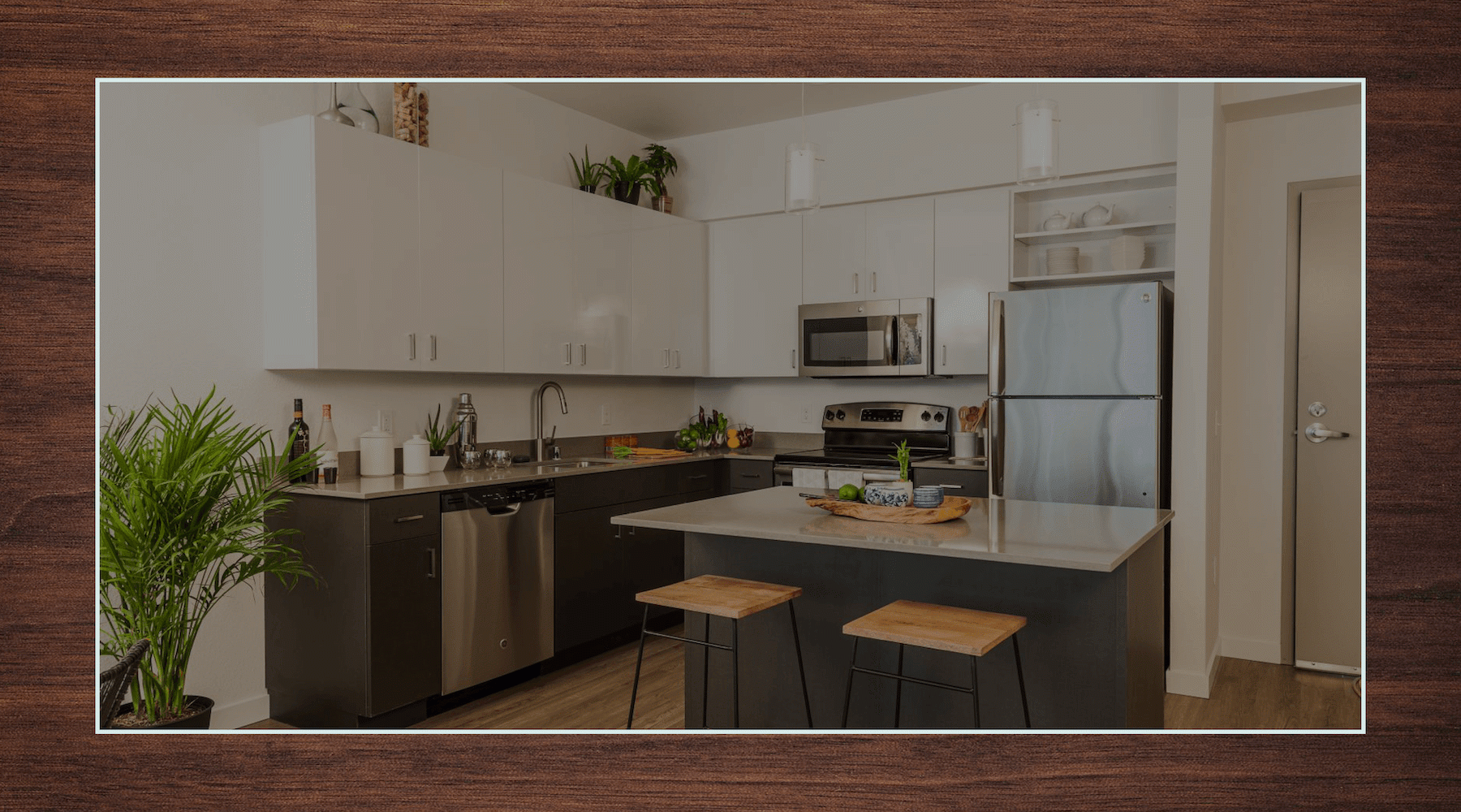 a kitchen with black and white cabinets